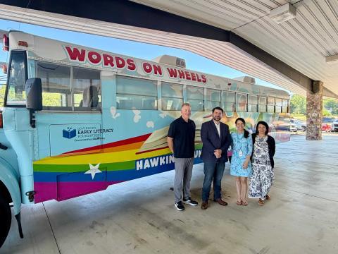 Congresswoman in front of Work on Wheels bus